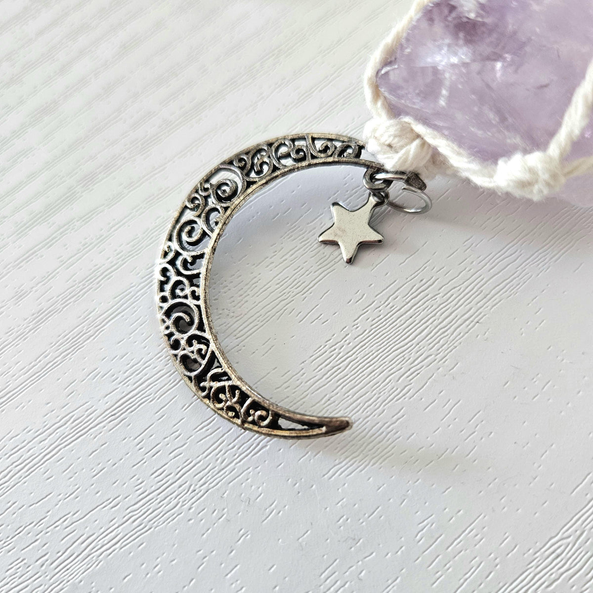 Macrame wrapped crystal rear view mirror charm. Amethyst and rose quartz. With moon charm.