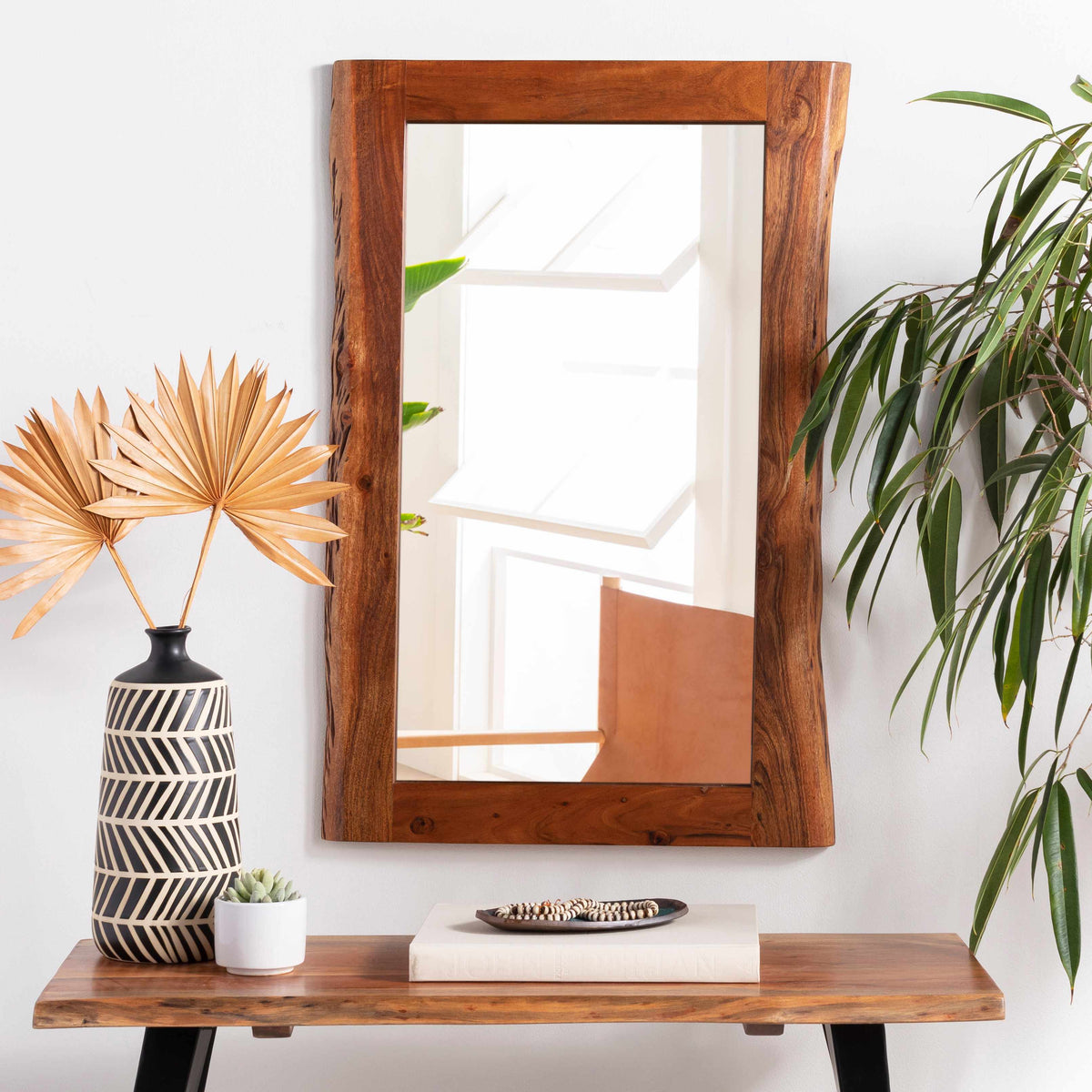 Williamsburg wood-frame mirror shown in a merchant room photograph