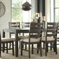 Rokane - Dining Room Table Set (Set of 7) - Brown