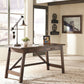 Baldridge - Home Office Large Leg Desk - Rustic Brown
