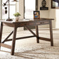 Baldridge - Home Office Large Leg Desk - Rustic Brown
