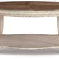 Realyn - Oval Cocktail Table - White / Brown