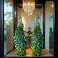 A pair of exquisite peacock ornaments standing on Roman columns add an artistic touch to the home.