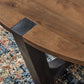 Hanneforth - Round Cocktail Table - Brown