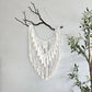Macrame wall hanging on Manzanita branch.