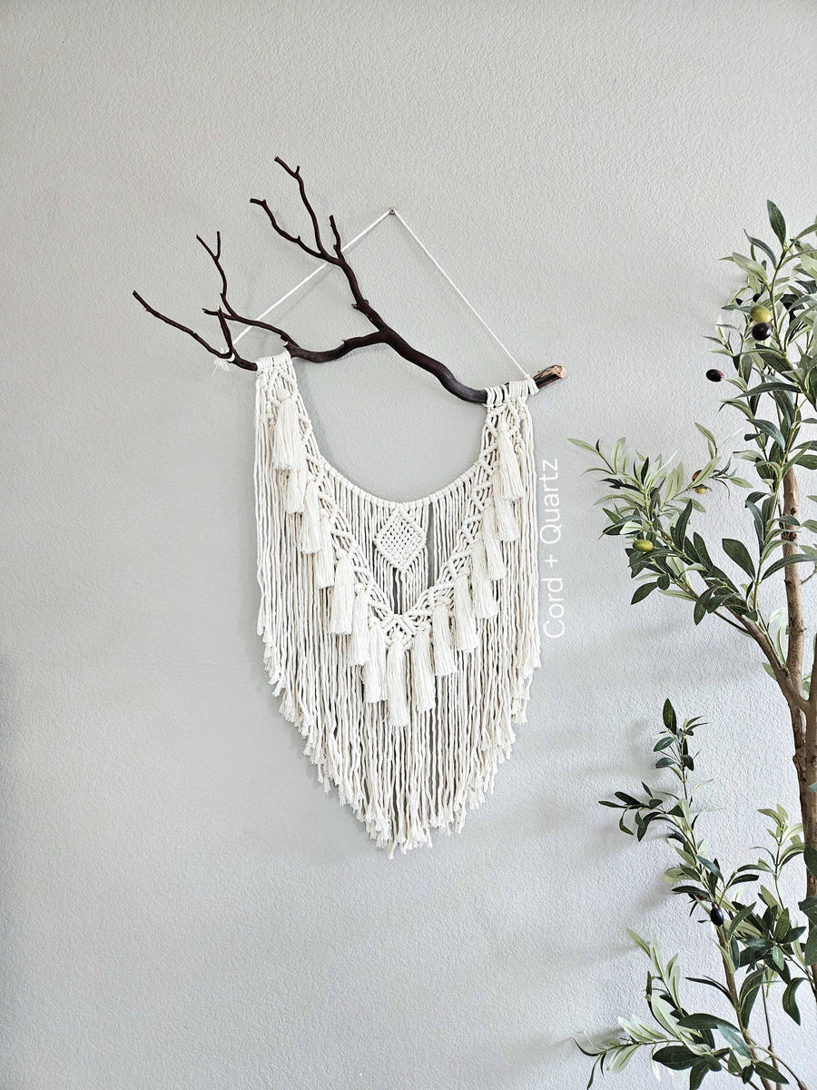 Macrame wall hanging on Manzanita branch.