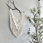 Macrame wall hanging on Manzanita branch.